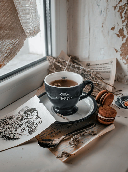 a cup of coffee sitting on top of a saucer