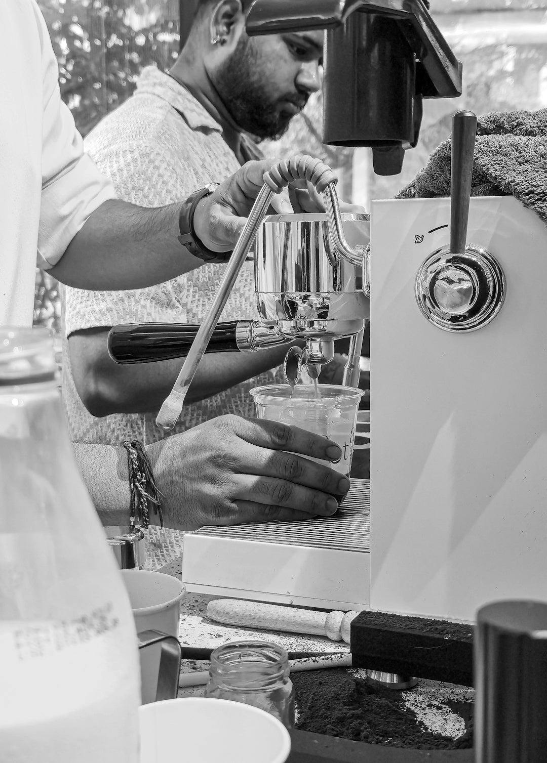 Barista making coffee with espresso machine